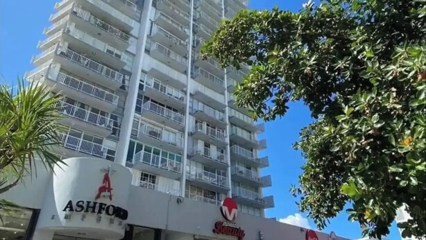 A multi-story hotel with a modern design, featuring a prominent Ashford sign at the ground level. - Condado Beach Condo - Fast Wi-Fi, AC, Pool & Security 24/7 (San Juan)