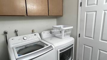 Washer and dryer located in hallway bathroom