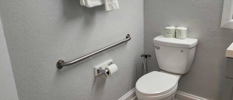 Shower, hair dryer, towels, shampoo