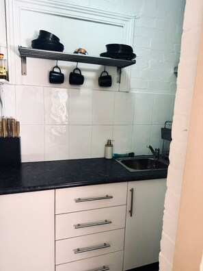 Fridge, microwave, stovetop, coffee/tea maker