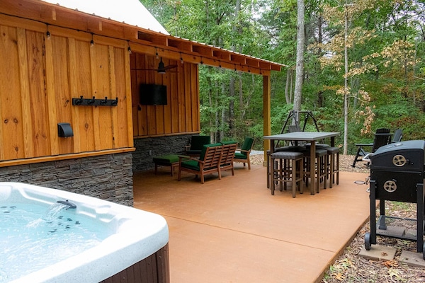 Spacious outdoor relaxation, with outdoor tv and convenient hot tub.