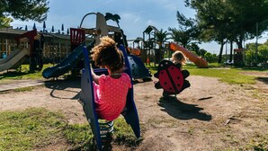 A playground with slides and climbing structures.