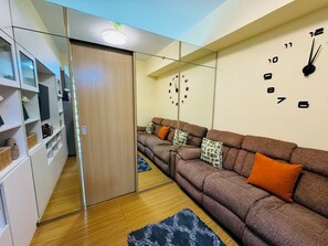 Living area - Cozy condo in enjoyable Taguig with WiFi, AC (Taguig)
