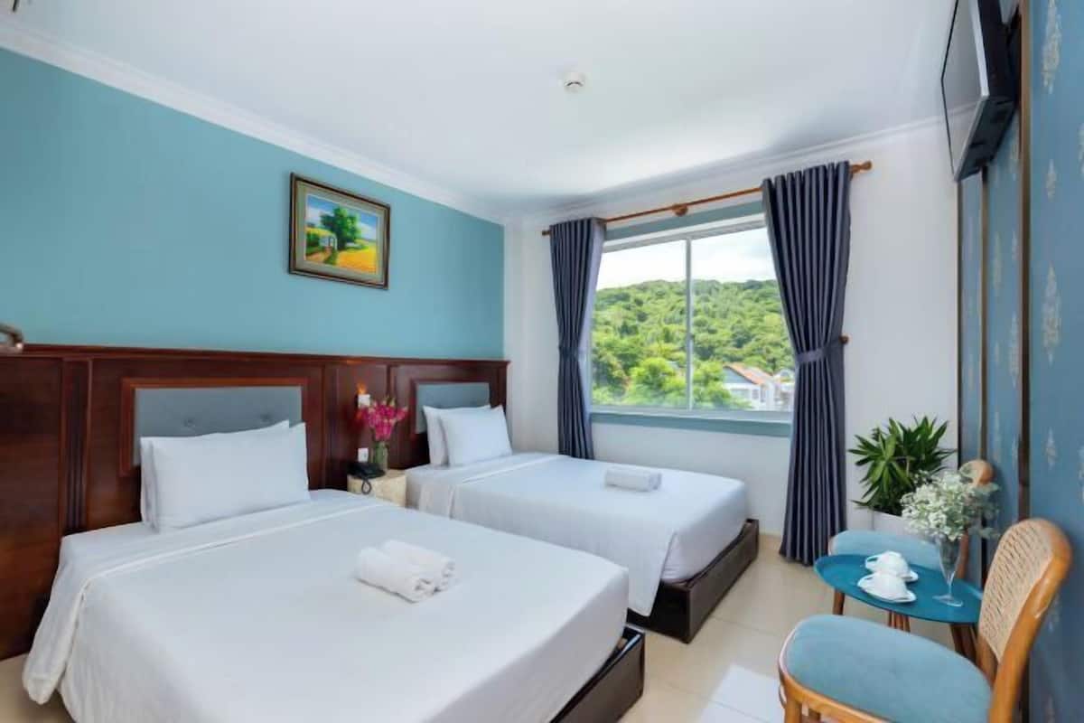 Premium bedding, memory-foam beds, minibar, desk