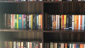 A bookshelf with a variety of books.