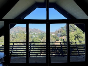 Enjoy breathtaking mountain views from the large window, perfect for sitting and taking in the scenery.