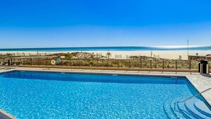 A swimming pool with a view of the beach and ocean. - The Palms 501 by Liquid Life (Orange Beach)