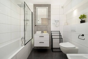 Shower, hair dryer, towels, shampoo