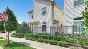 A two-story residential building with a gated driveway and a no parking sign. - 2 Mi to Dtown: Convenient Houston Home! (Houston)
