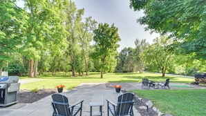 A patio with outdoor furniture, a grill, and a well-maintained lawn. - Near Trails + Wineries: Victor Getaway w/ Fire Pit (Victor)
