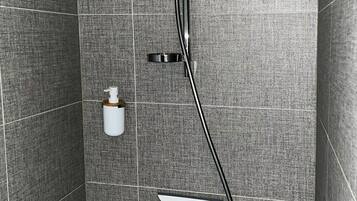 A modern shower with a handheld showerhead, a handheld shower attachment, and a wall-mounted faucet.