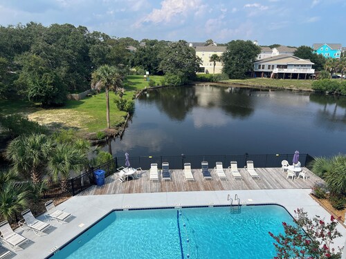 Gorgeous modern condo with unmatched view looking out over the pool!