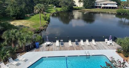 Gorgeous modern condo with unmatched view looking out over the pool!