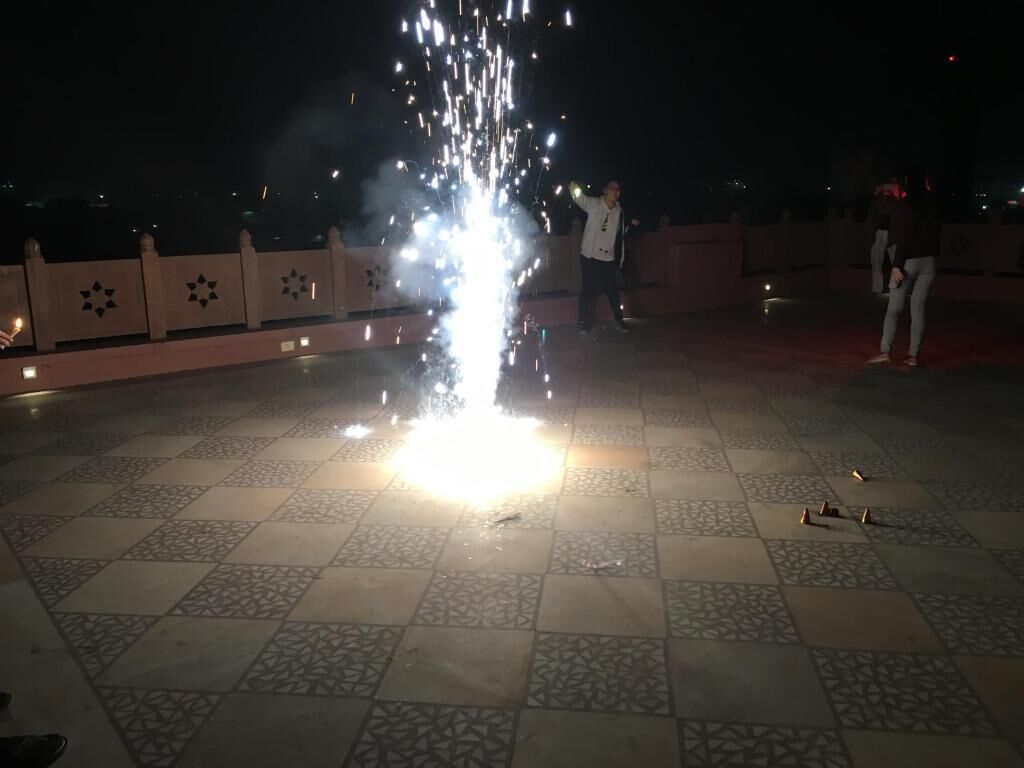 A tiled floor with a firework display.