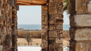 A stone structure with a view of the sea and beach. - Diamond of Cyclades (Kastraki)