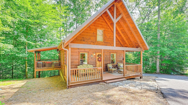 A wooden cabin with a porch, a covered deck, and a stone pathway leading to the entrance. - Serene Cabin < 1 Mi to Fairy Stone State Park! (Stuart)
