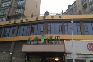 A hotel building with a prominent sign indicating it is a hotel.