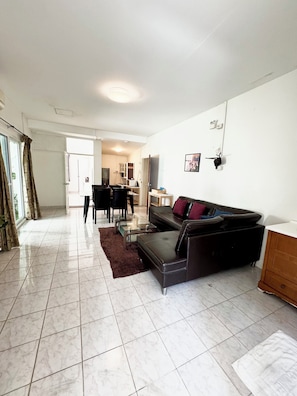 Standard Apartment, 2 Bedrooms, City View, Beachside | Living area | 32-inch LCD TV with cable channels