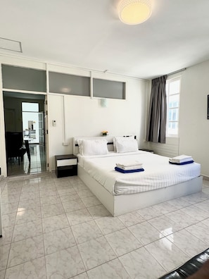 Standard Apartment, 2 Bedrooms, City View, Beachside | Minibar, desk, laptop workspace, iron/ironing board