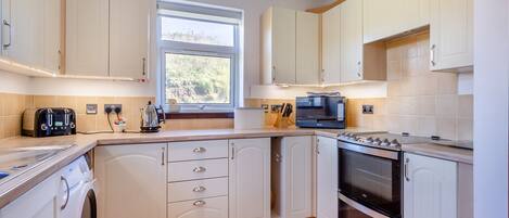 Astianpesukone, syöttötuoli