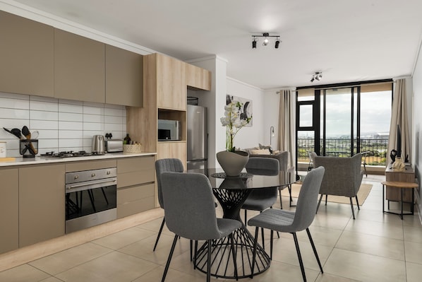 Fridge, microwave, oven, stovetop - Views From Century City Apartment (Cape Town)