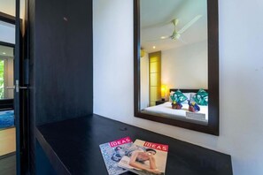 A hotel room with a large mirror, a magazine on the table, and a view of the room's interior. - 5 Bedroom Amazing Pool Villa in Resort (TS1) (Hua Hin)