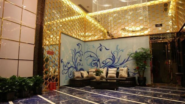 A lobby with a patterned wall, a seating area with cushions, and a marble floor. - Yueqing Jane Eyre Theme Hotel (Yueqing)