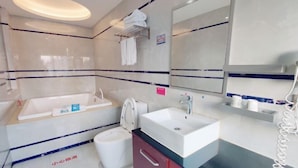 A modern bathroom with a bathtub, sink, and toilet. - Yueqing Jane Eyre Theme Hotel (Yueqing)