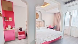 A modern bedroom with a pink wardrobe, a bed with white bedding, and a small bedside table. - Yueqing Jane Eyre Theme Hotel (Yueqing)
