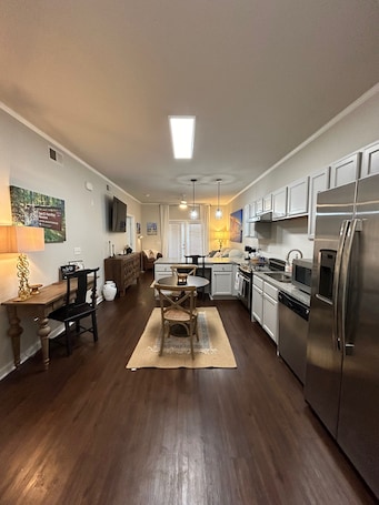 Fridge, microwave, oven, stovetop. Walk to Campus, Cotton District, and Downtown!!!