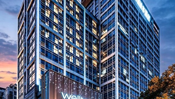 A modern hotel building with a prominent 'Wellton City' sign.