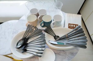 A table set with multiple spoons and cups, a bowl, and a plate. - Grace Heiwajima (Tokyo)