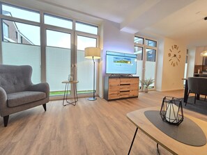 TV, ping pong - Vacation apartment Meeresrauschen on the first floor with garden, sauna and pet (Norden)