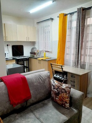 Classic Studio Suite, City View | Private kitchen | Microwave, cookware/dishes/utensils - Lux Suites Chapell Hill Apartments  (Ngong)