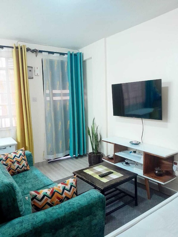 Comfort Studio Suite, City View | Living area | 24-inch Smart TV with digital channels - Lux Suites Chapell Hill Apartments (Ngong)