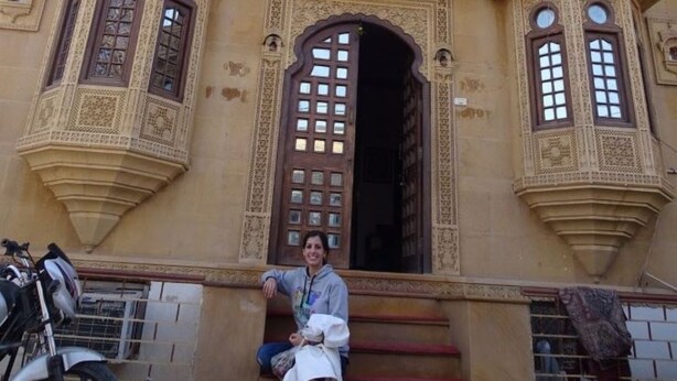 A building with ornate architectural details, including multiple windows with intricate designs and a central doorway. - Hotel Bharat Villas Jaisalmer (Jaisalmer)