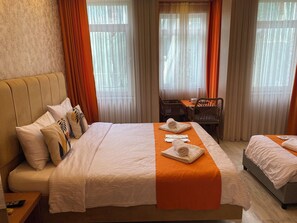 Basic Triple Room, City View | Desk, laptop workspace, free WiFi