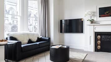 Premium Apartment, City View | Living area | Flat-screen TV
