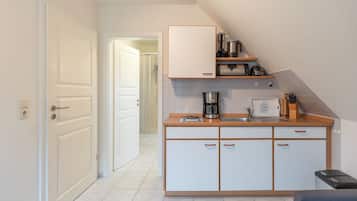 Fridge, stovetop, coffee/tea maker, cookware/dishes/utensils