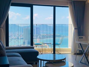 Romantic Apartment, Sea Facing | Living area | 32-inch flat-screen TV with digital channels - Gold Coast Apartment (Nha Trang)