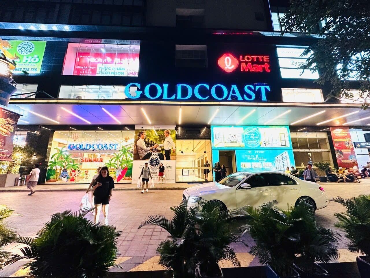 A building with a prominent 'GOLDCOAST' sign and a 'LOTTE Mart' sign above it.