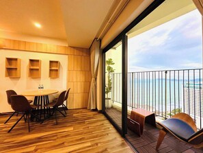 Deluxe Apartment, Sea View | Living area | 32-inch flat-screen TV with digital channels - Gold Coast Apartment (Nha Trang)