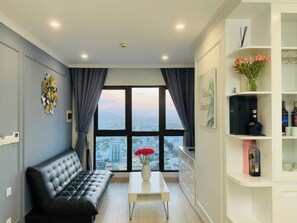 Apartment, Ocean View | Living area | 32-inch flat-screen TV with digital channels - Gold Coast Apartment (Nha Trang)