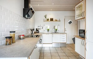 Fridge, stovetop, dishwasher, coffee/tea maker