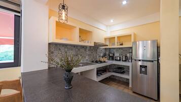 Fridge, microwave, stovetop, coffee/tea maker