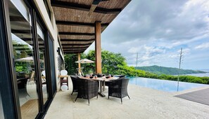 Outdoor dining - Beautiful modern style home with panoramic ocean view (Playa Hermosa)