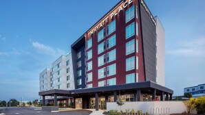 A multi-story hotel with a modern design, featuring a prominent "Hyatt Place" sign on the facade. - Hyatt Place Cape Canaveral (Cape Canaveral)