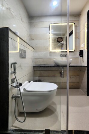 Executive Room, City View | Bathroom | Shower, hair dryer, slippers, towels - Kashi Vilaa (Varanasi)