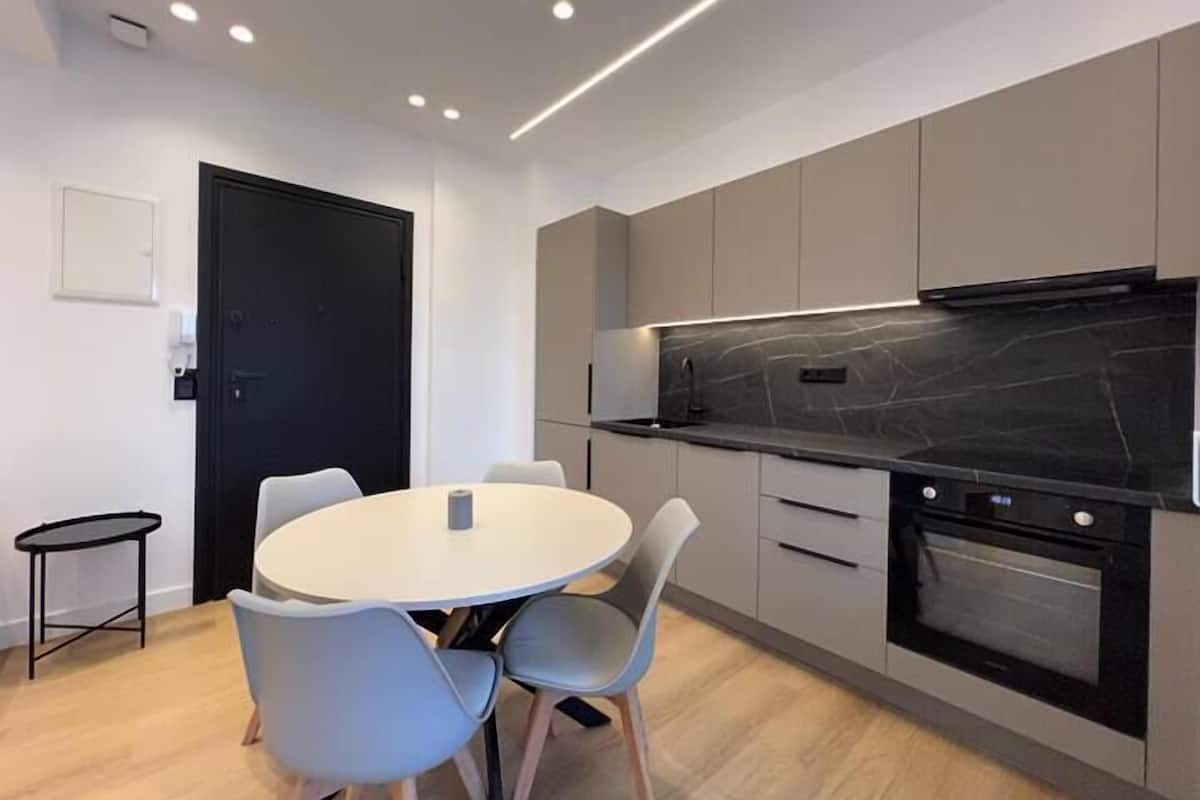 Exclusive Apartment | Private kitchen | Full-size fridge, stovetop, cookware/dishes/utensils