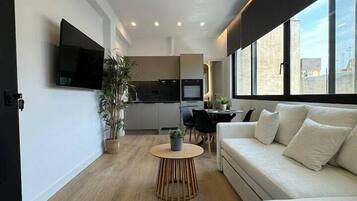 Deluxe Apartment, Harbor View | Living area | Flat-screen TV